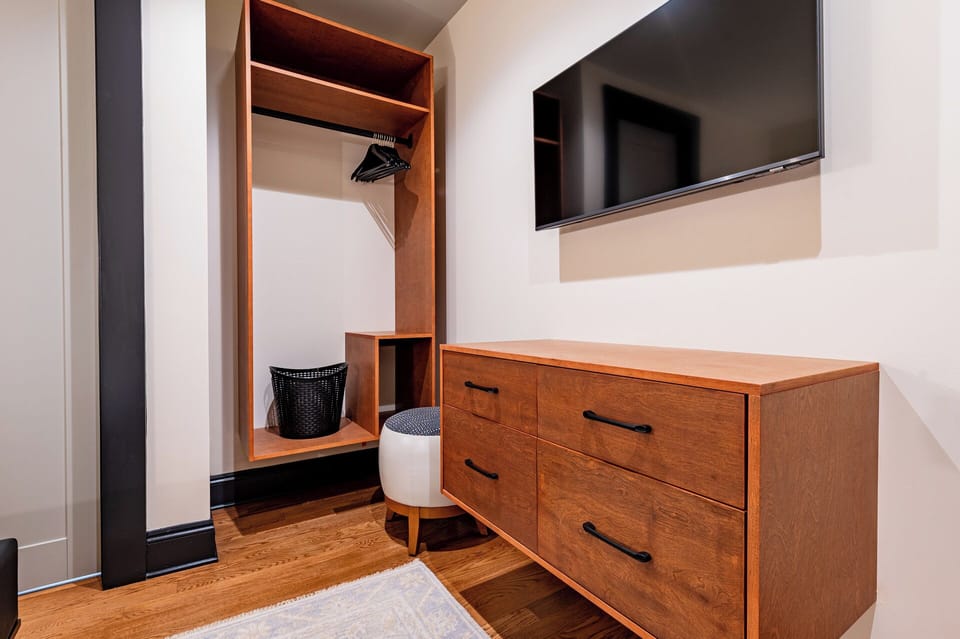 Bedroom 3 - Closet space equipped with hangers and laundry hamper.