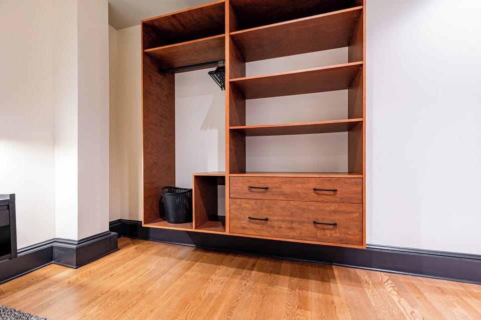 Bedroom 4 - Closet space equipped with hangers and laundry hamper.