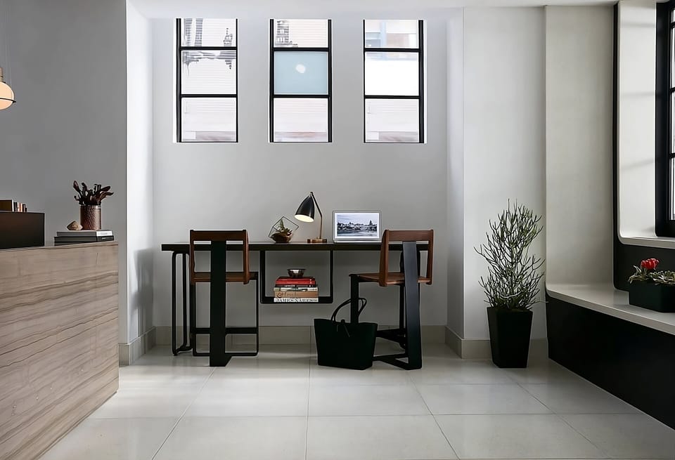 Settle in and work comfortably in this sunlit, stylish nook.