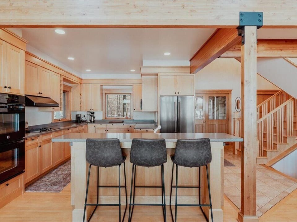 Kitchen view + barstools for additional seating
