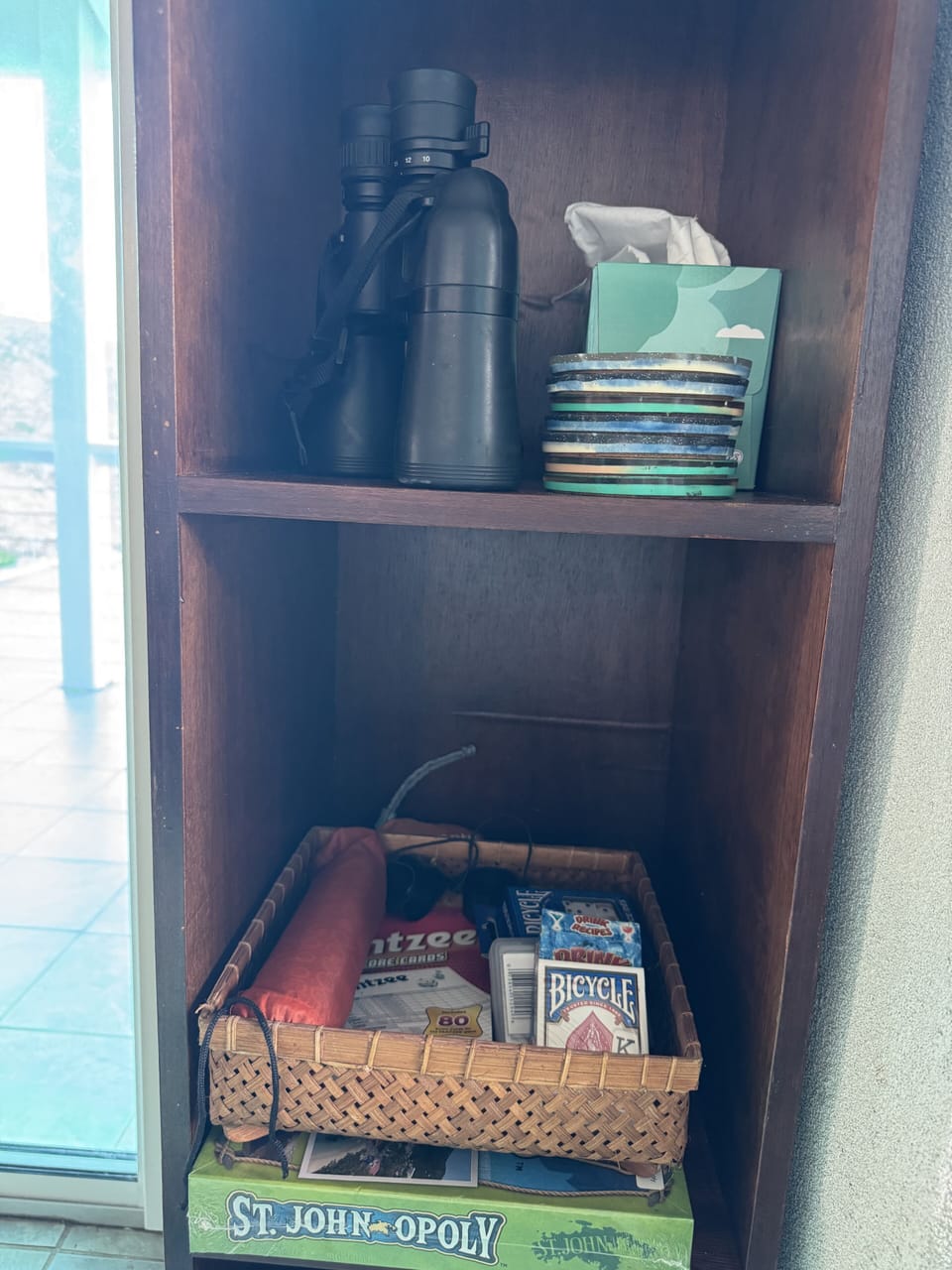 Binos, games, cards, spare batteries, etc in the living room.
