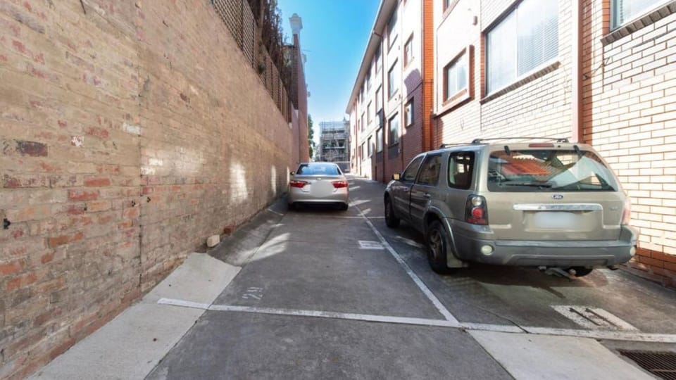 Private rear laneway access with convenient parking and easy entry for added accessibility and convenience.
