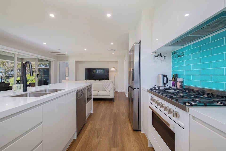 The kitchen is designed around a central island and comes fully equipped for your holiday catering.
