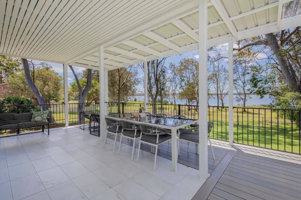 The lower deck offers ample seating for alfresco dining with waterfront views.