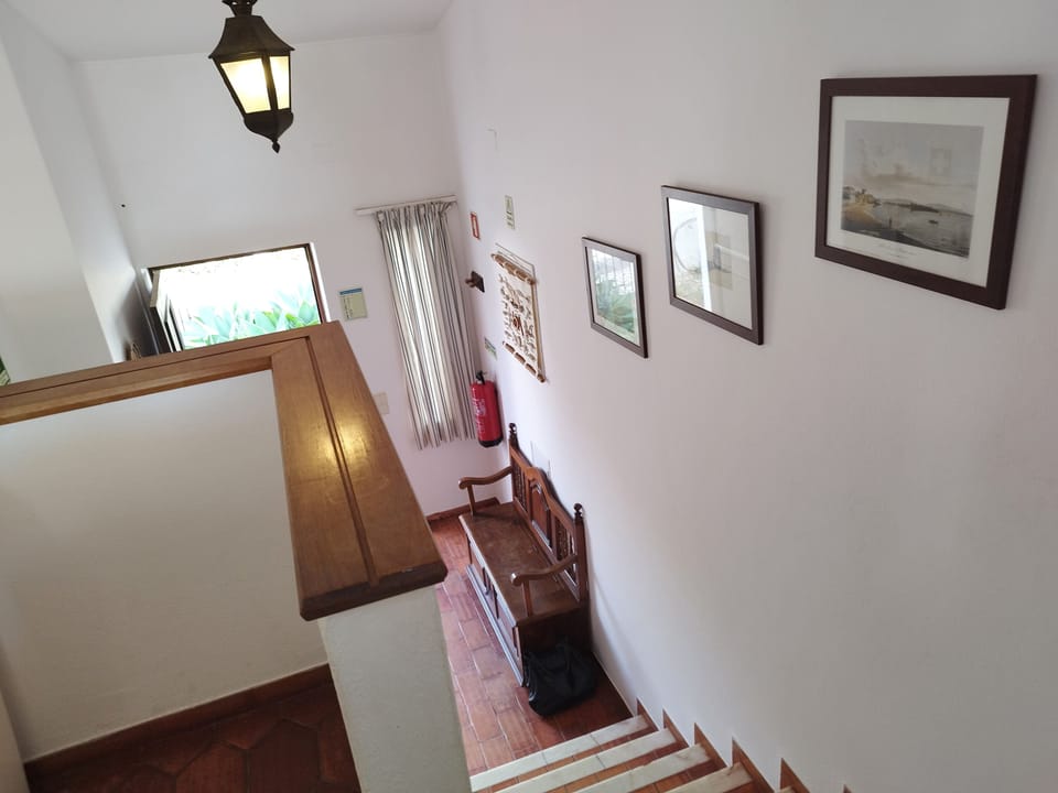 Stairs from the Living Area leading down to the front hall
