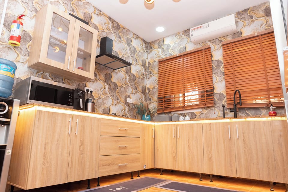 Full kitchen pots, pan,  and wine glasses, Blender, Airfryer, microwave /grill..