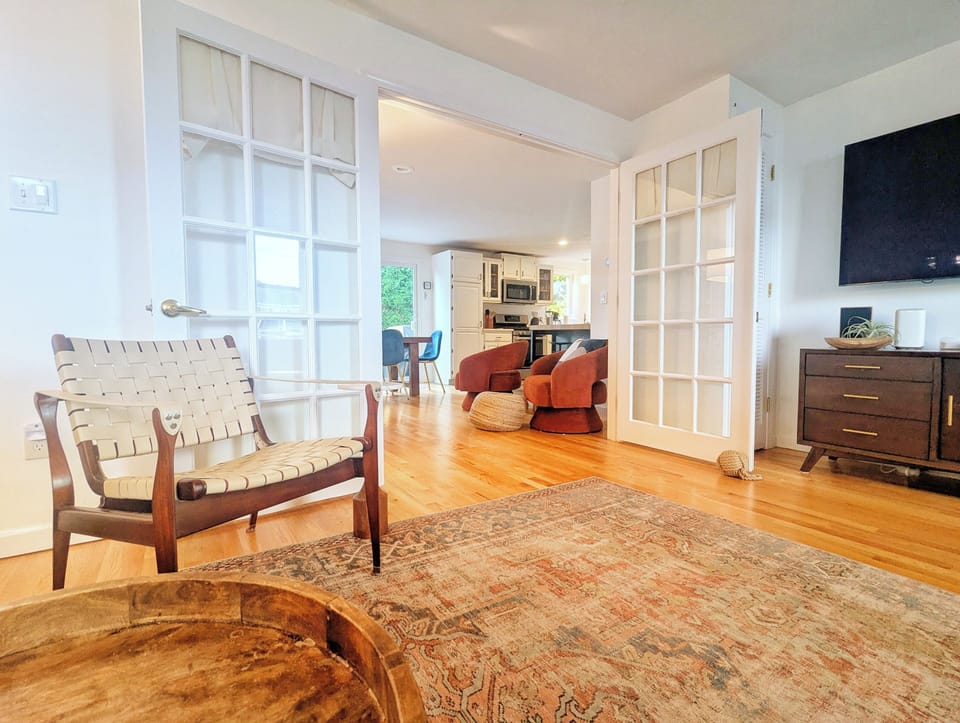 Doors with curtains close off the living room for sleeping on the pull out couch