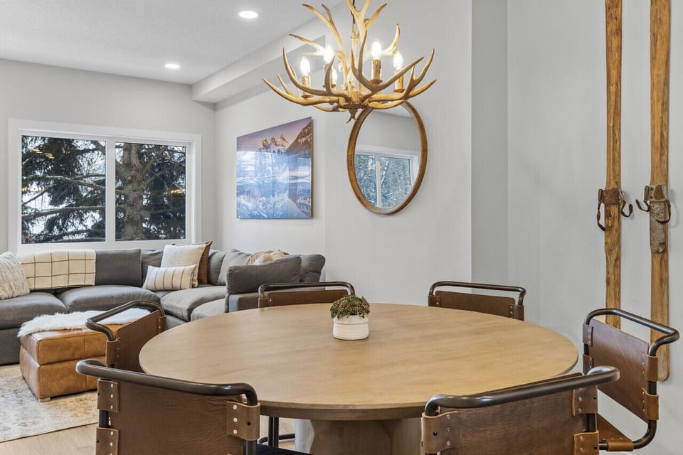 Thoughtfully chosen pieces like this antler chandelier add a touch of rustic character to this ultra modern townhouse