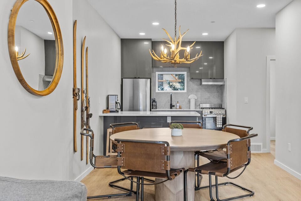 Six guests can gather around this round wooden dining table