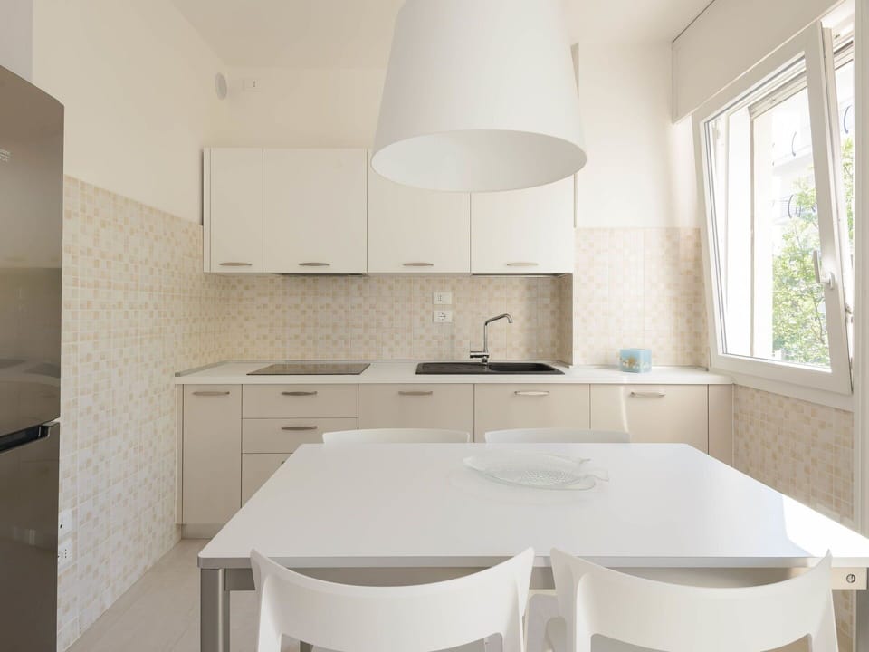 Interior Design, Flooring, Kitchen, Countertop, Furniture, Floor, Wood, Ceiling, Light Fixture, Lighting