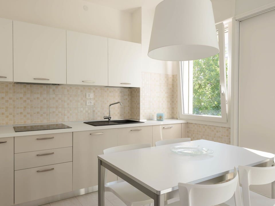 Kitchen, Countertop, Furniture, Interior Design, Flooring, Kitchen Appliance, Wood, Cabinetry, Major Appliance, Floor