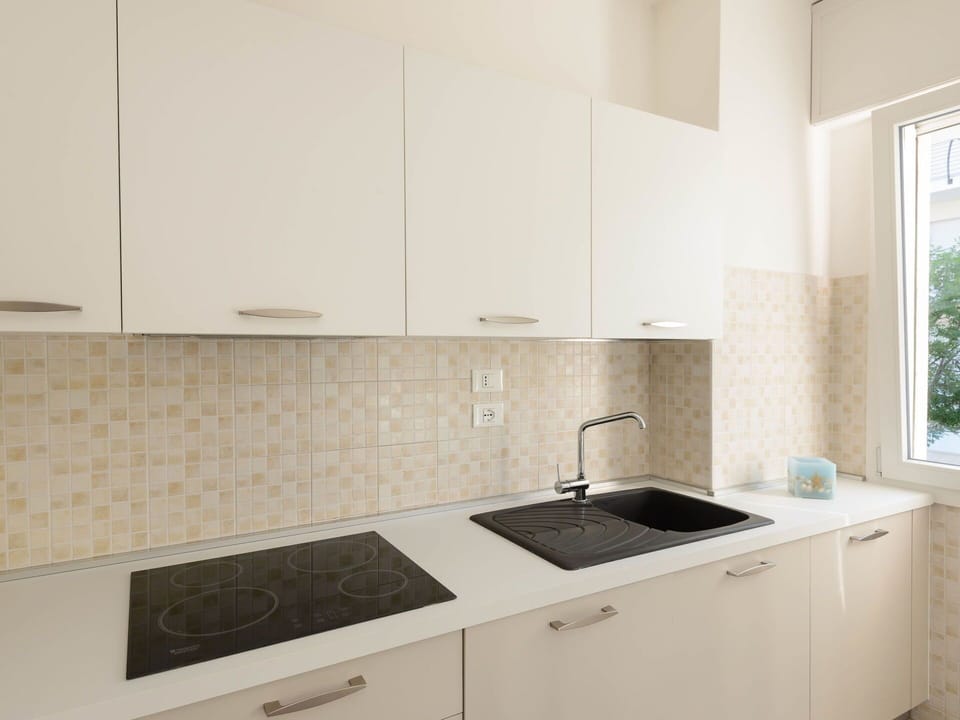 Countertop, Kitchen, Flooring, Interior Design, Wood, Cabinetry, Floor, Sink, Kitchen Appliance, Tap