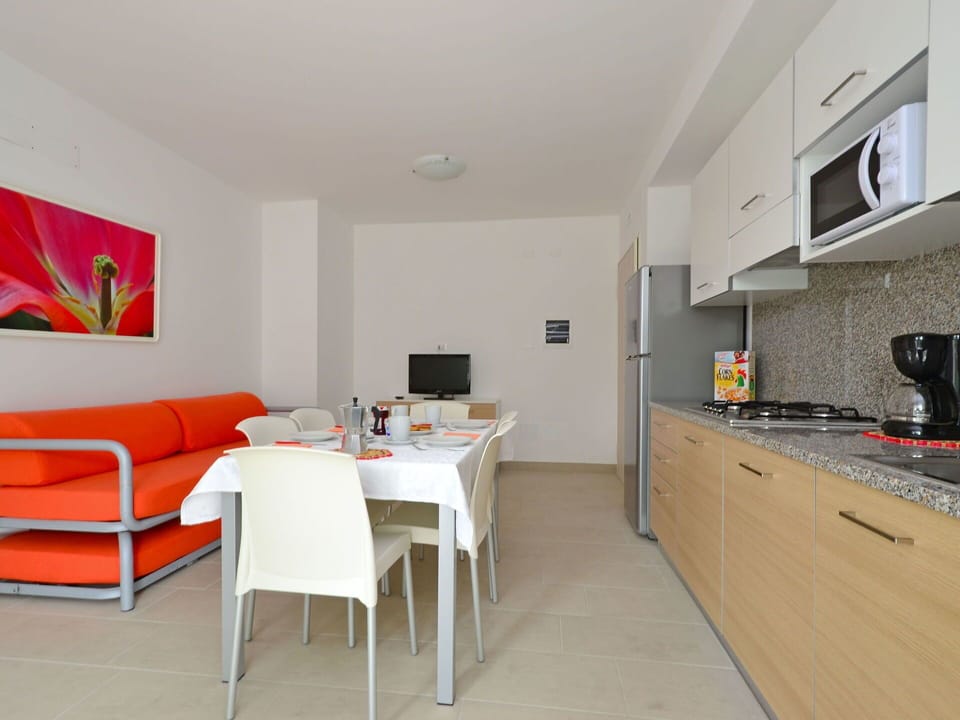 Furniture, Flooring, Interior Design, Floor, Chair, Apartment, Kitchen & Dining Room Table, Wood Stain, Resort