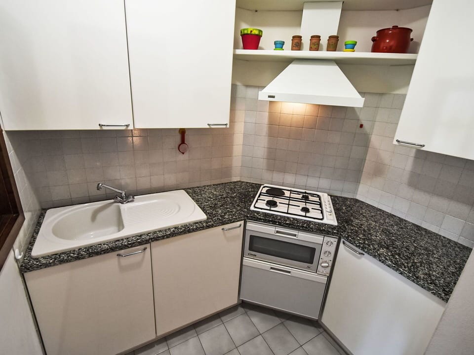 Kitchen, Kitchen Appliance, Major Appliance, Kitchen Stove, Countertop, Gas Stove, Stove, Flooring, Cabinetry, Home Appliance