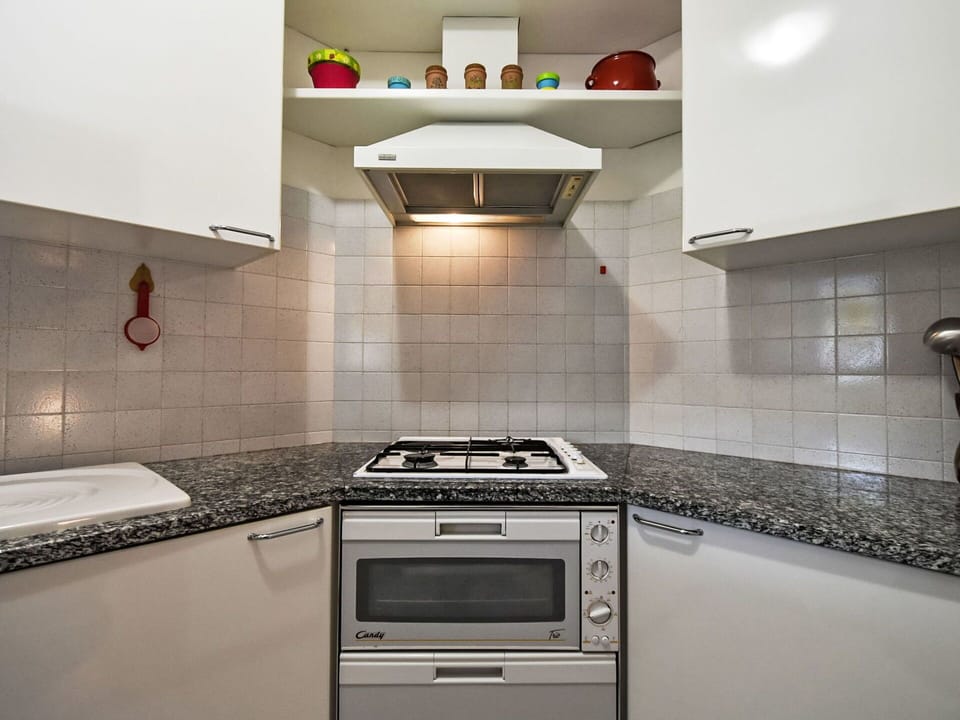 Kitchen, Kitchen Appliance, Kitchen Stove, Major Appliance, Countertop, Gas Stove, Stove, Flooring, Cooktop, Home Appliance