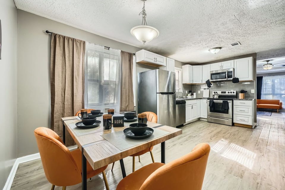 A comfy and well-lit dining area that seats 4.