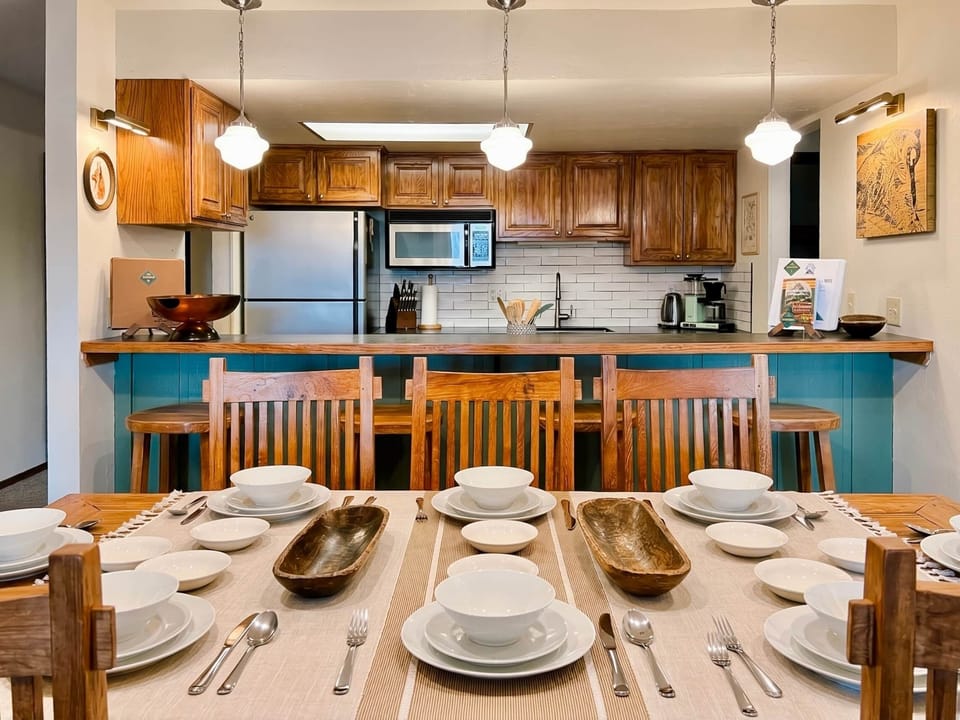 Dining table next to kitchen