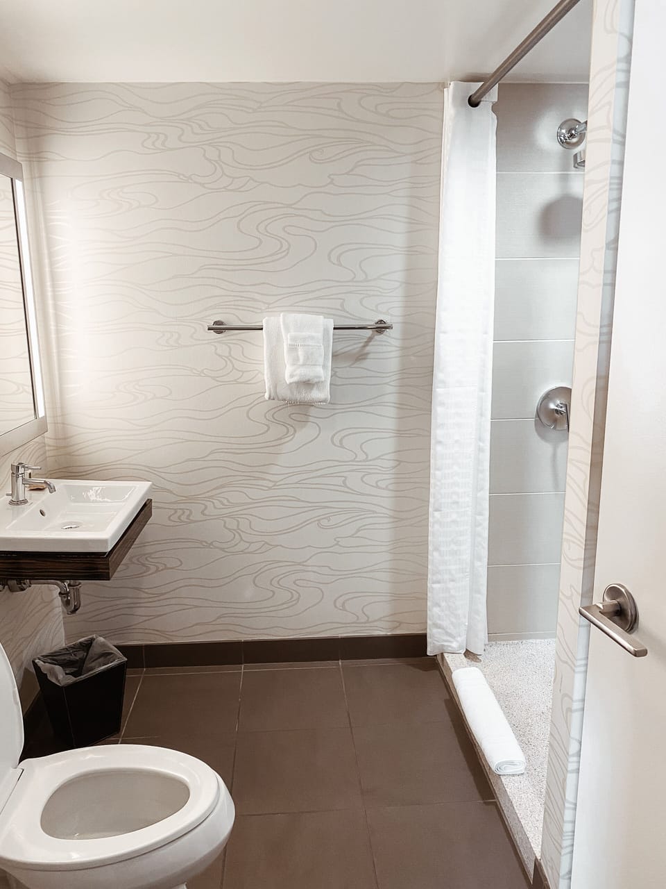 Refresh easily in a clean, minimalist bathroom with walk-in shower.
