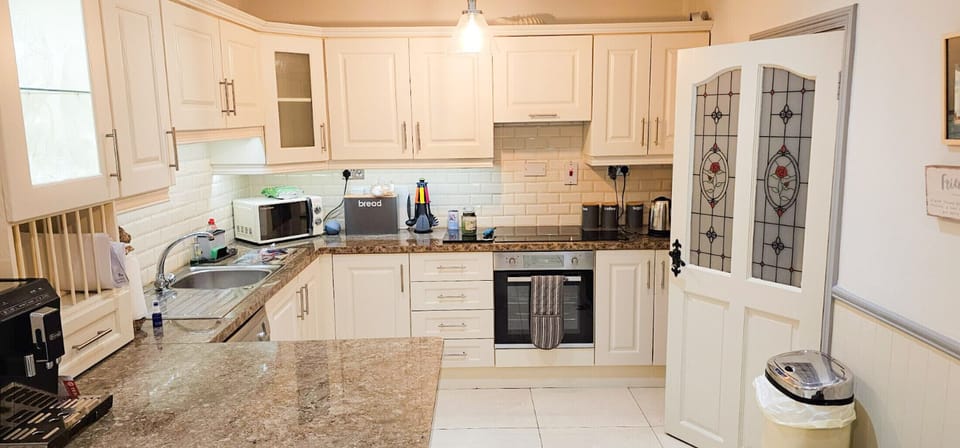 Passage East Co Waterford Holiday Home close to Ferry.  Modern white clean bright kitchen, marble counter, tiled floors. All modern conveniences.