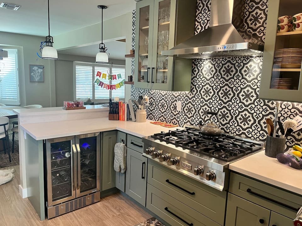 6 Burner cook top and wine fridge with curated wine list for purchase options