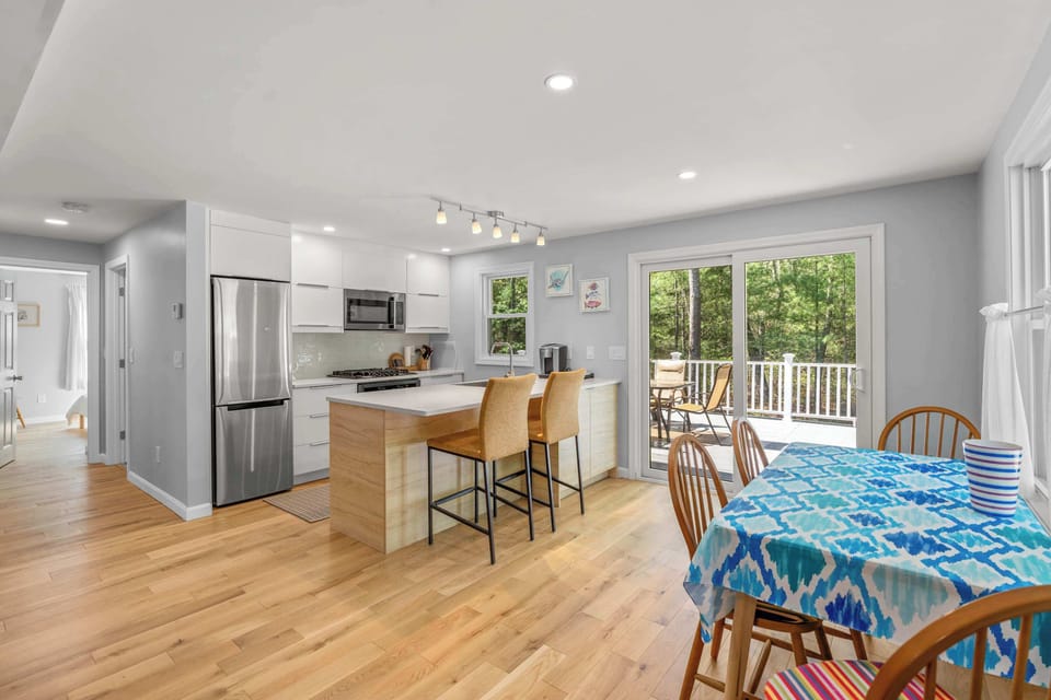 Gather for meals together at the dining table, offering seating for 4