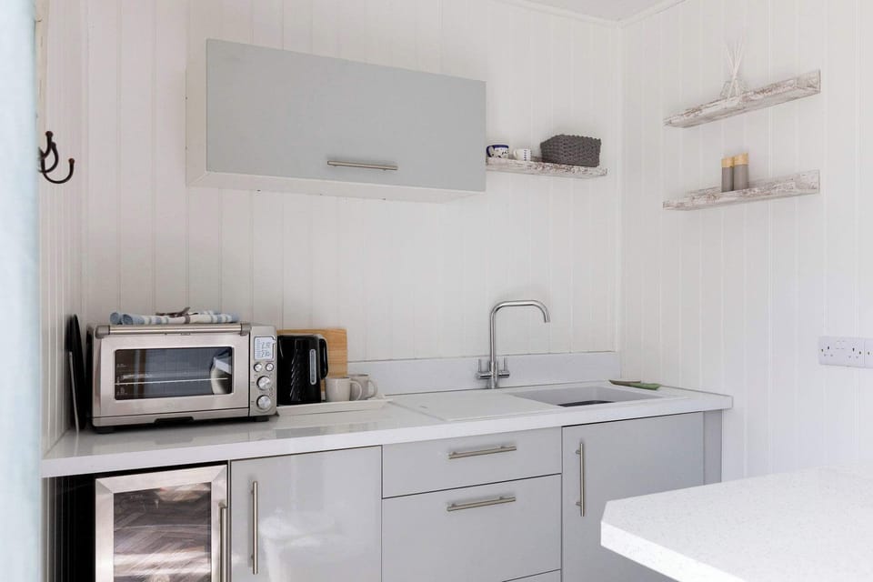 There is a small microwave oven for you to make all your meals and snacks, a mini fridge along with tea making facilities.