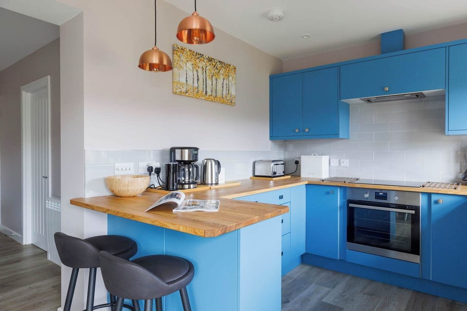 The fully equipped kitchen has all the modern amenities you need to prepare meals for family and friends.