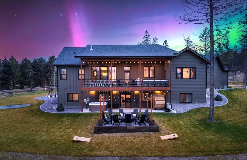 Welcome to a home where modern luxury meets an entertainer’s dream, with breathtaking views of a starry night sky and the Northern Lights!
