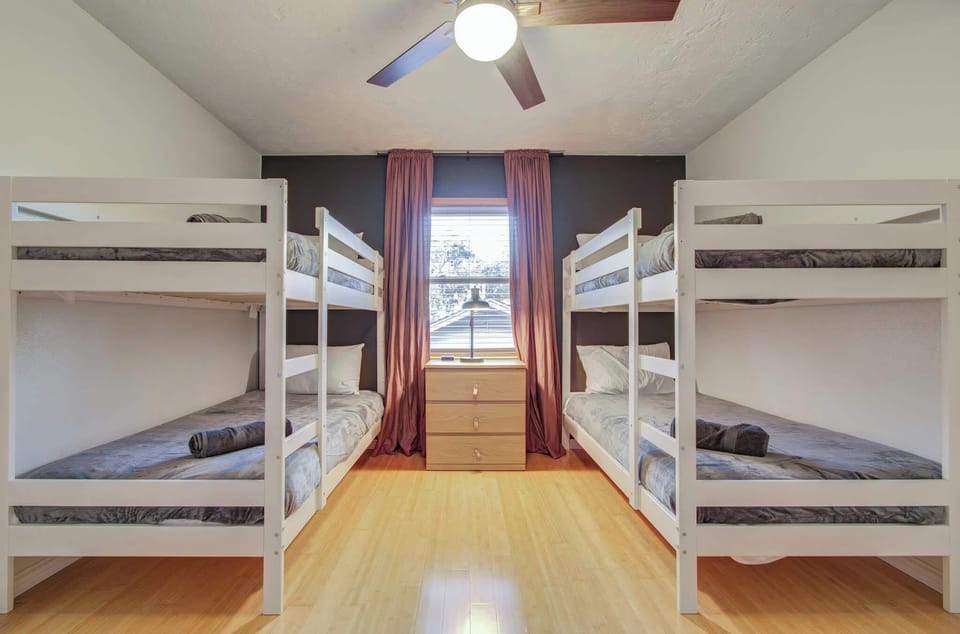 Can’t decide if you prefer the top bunk or the bottom bunk? With two bunk beds in this bedroom, there are double the options for your sleeping preferences!