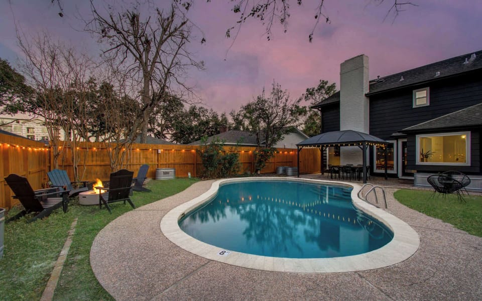 Welcome to a backyard oasis! Beautifully landscaped for a resort-like feel, take a dip in the pool, settle in around the cozy fire pit, or enjoy an al fresco dinner on the patio.