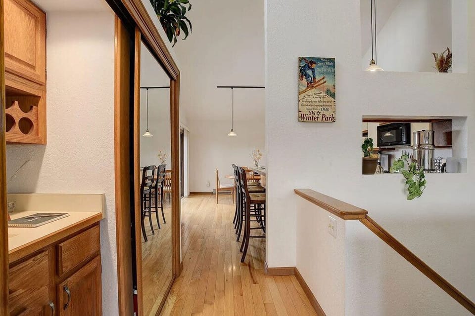 Your open-concept kitchen flows seamlessly into the dining area, where warm wood accents and vintage touches create an inviting atmosphere for memorable meals.