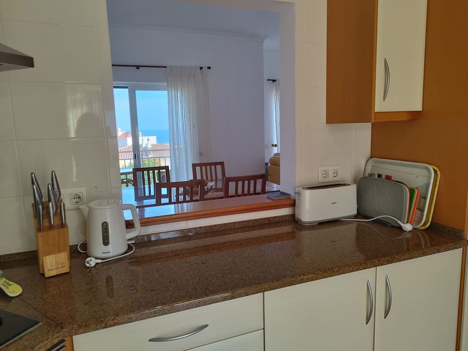 Handy service hatch connects kitchen to dining area