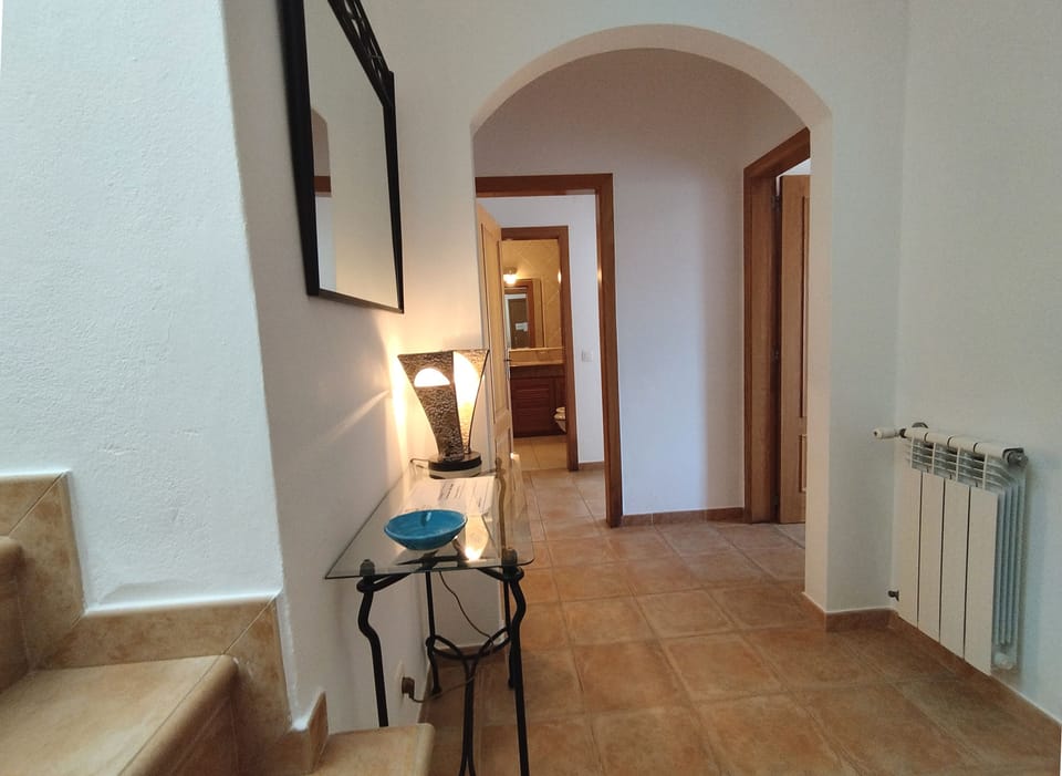 Hall corridor: Shower Room on left, Ensuite Bedroom 1 ahead & Bedroom 2 on right