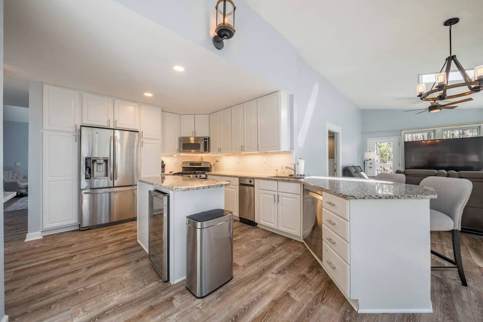 The wrap around kitchen has granite countertops and stainless steel appliances and is fully stocked.