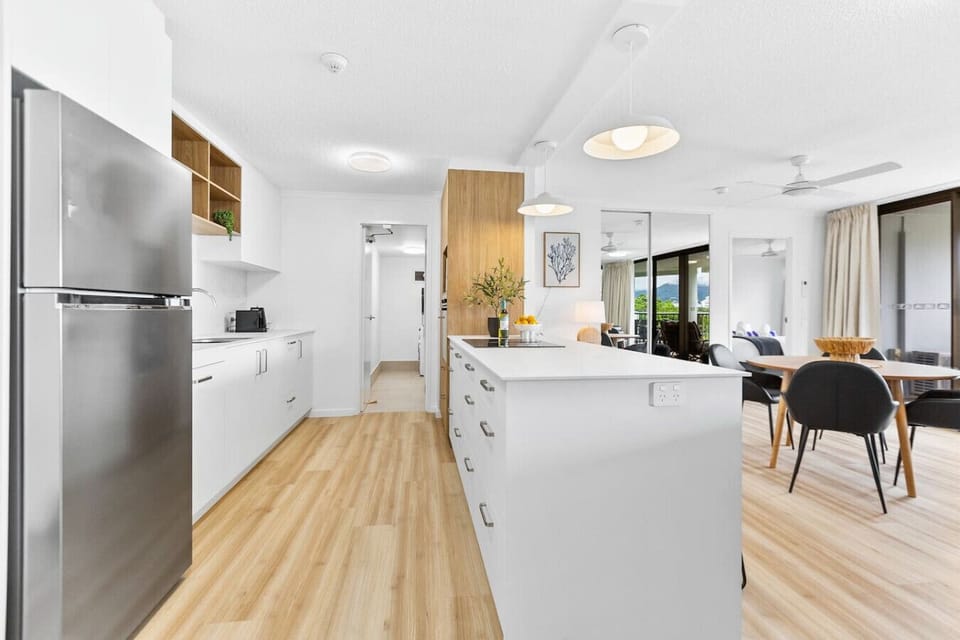 This stunning new kitchen blends modern design with functionality, offering sleek appliances and plenty of space. Enjoy beautiful views of the living room and balcony, making it the perfect spot for both cooking and socializing.