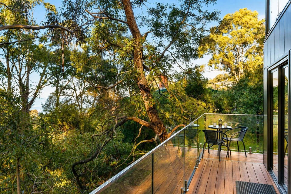 Wake to peaceful bushland and glimpses of the Derwent River from your private balcony at Treetops Retreat.
