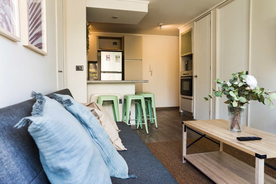 Relax in this stylish studio with a cozy living area and modern kitchen, perfect for a comfortable stay in the heart of Chile.