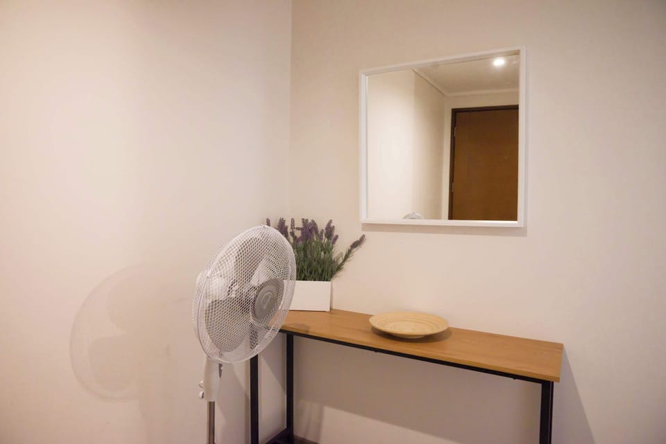 Charming entryway with a stylish console table and mirror, perfect for a welcoming touch.