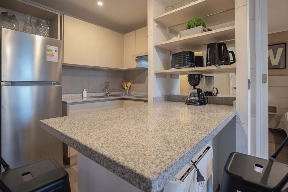 Cocina equipada con todo lo necesario para preparar tus comidas favoritas 