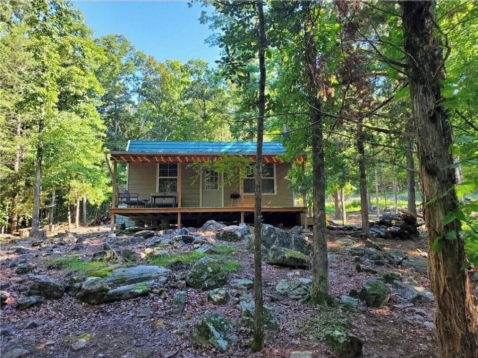 Quaint and private front porch provides a perfect setting to relax and unwind. 
