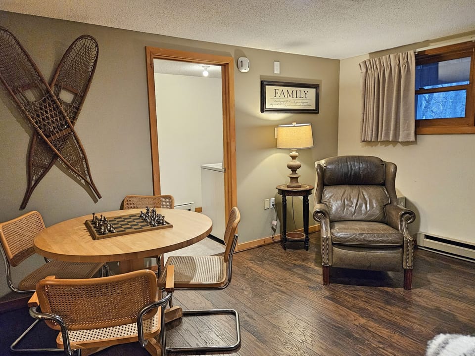 Game and seating area with laundry beyond
