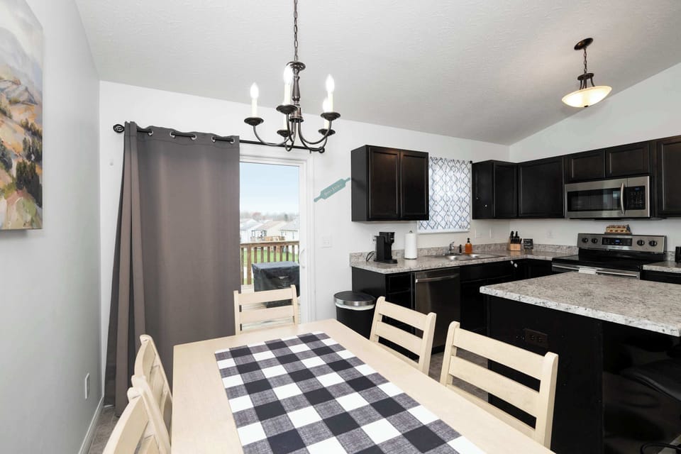 Gather for meals together at the dining table, offering seating for 6