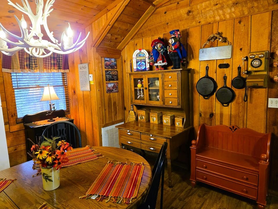 This charming original log cabin is decorated with days-gone-by for cozy comfort
