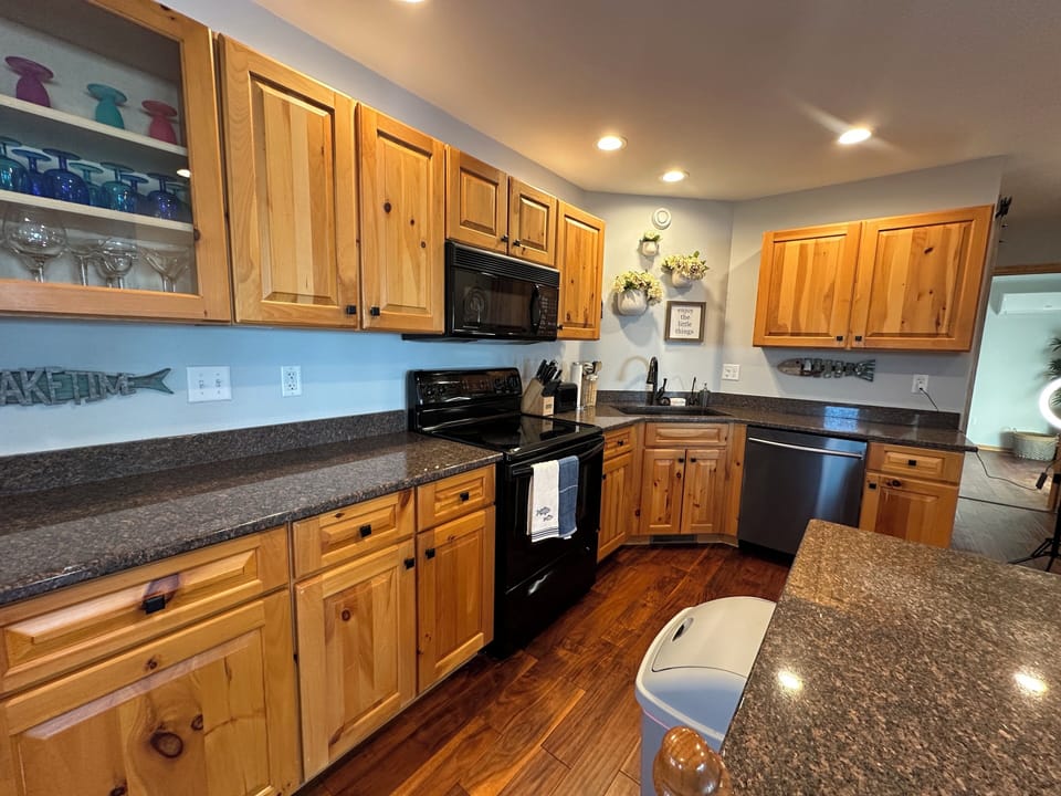 The kitchen is fully stocked with all the essentials, including modern appliances. 