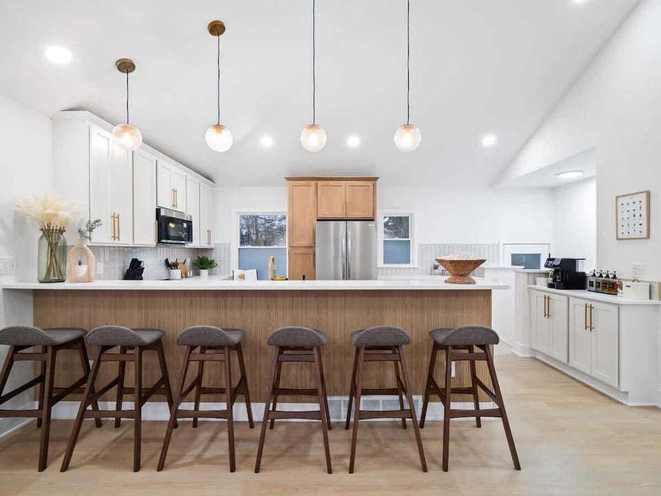 Modern farmhouse vibes, perfectly balanced.  The open concept flows seamlessly, creating a space for both work and play.