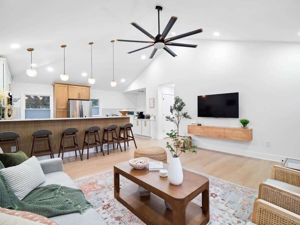 Open kitchen & living space w/ island seating & relaxed layout