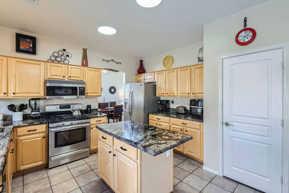Kitchen has granite countertop