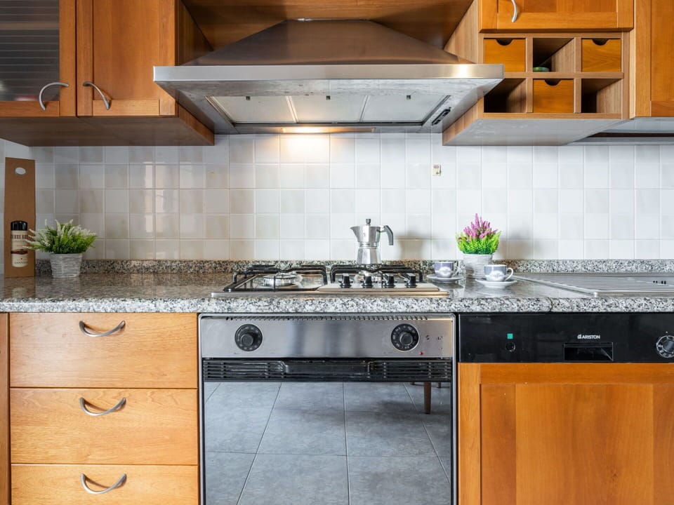 Kitchen, Kitchen Appliance, Countertop, Cabinetry, Major Appliance, Kitchen Stove, Stove, Gas Stove, Home Appliance, Flooring