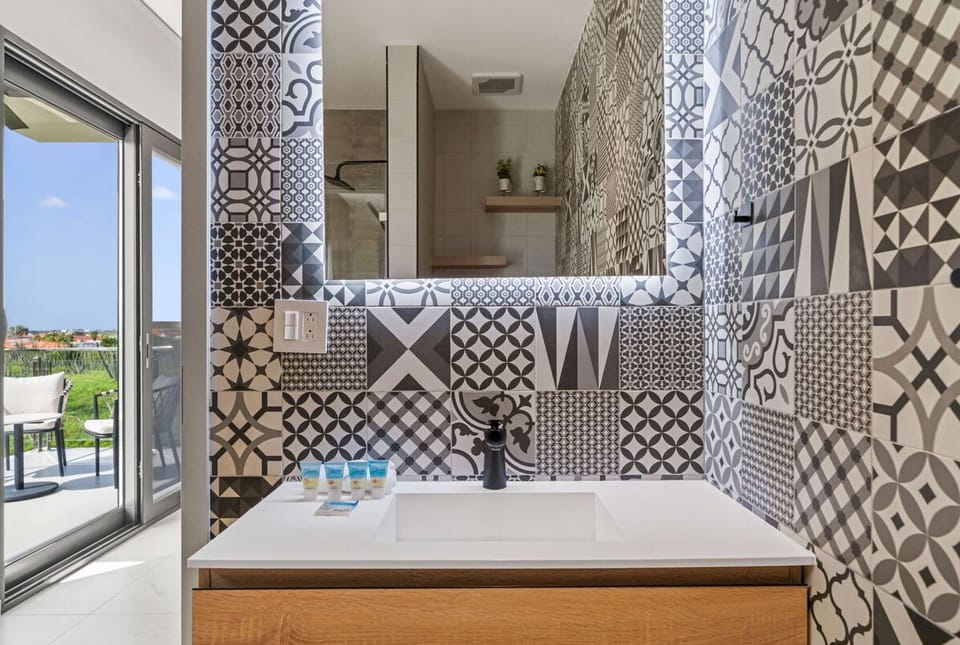 - Make a statement with this stylish vanity set against bold, patterned tiles and modern lighting
- The artistic design creates a stunning focal point that exudes personality
- A functional yet chic space for your morning routine