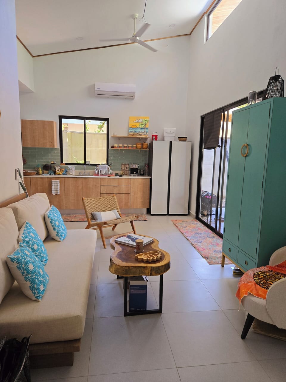 Open floorplan with high ceilings, boasting natural light & artful garden views.